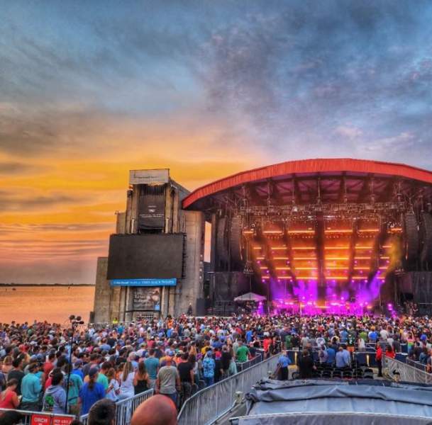 outdoor concert during sunset by the beach
