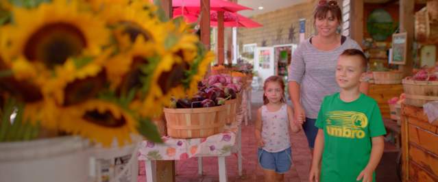 Mother and kids shopping for Local Produce