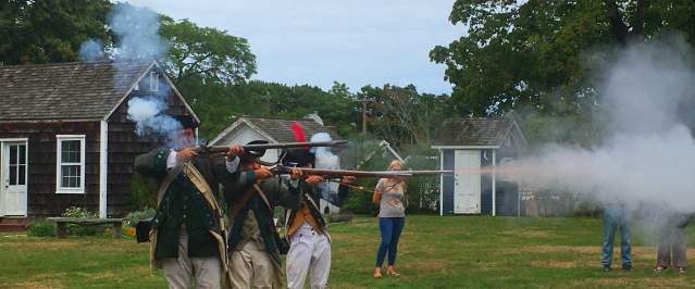 A Revolutionary War reenactment occurring at the Southold Historical Museum on Long Island.
