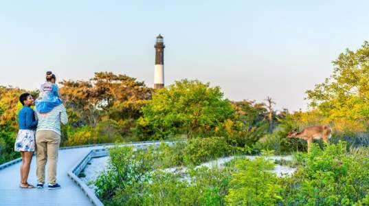 family visiting lighthouse