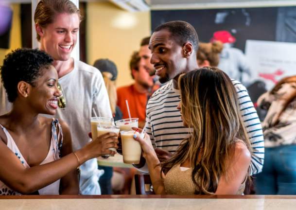 2 couples enjoying drinks