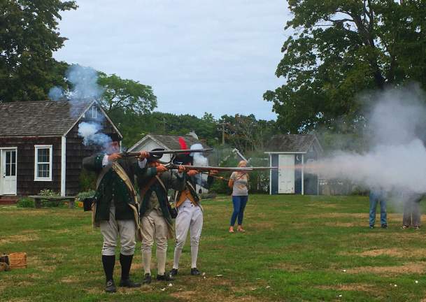 A Revolutionary War reenactment occurring at the Southold Historical Museum on Long Island.