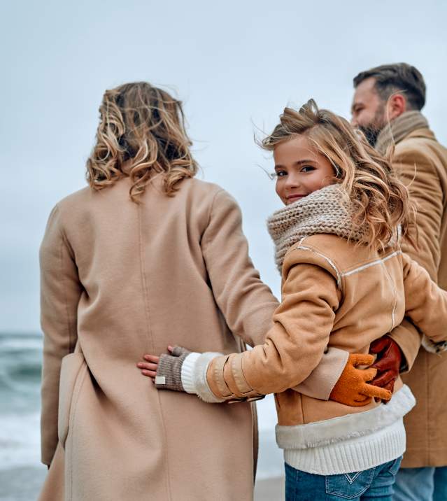 Family at beach in winter