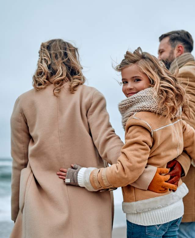 Family at beach in winter