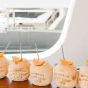 Personalized "Britt's Bach Club" coconuts served as tropical drinks for a Cabo bachelorette party.