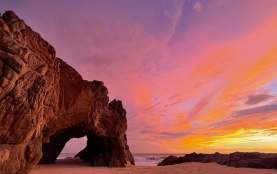 The Arch of Cabo San Lucas at sunset in Los Cabos, Mexico
