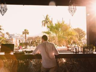 Man at Bar During Late Afternoon