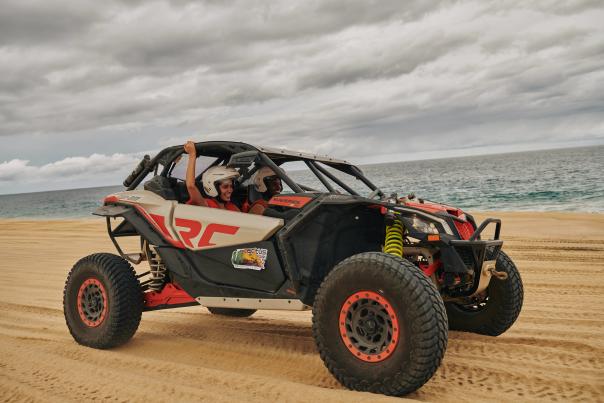 Couple driving in 4 wheeler