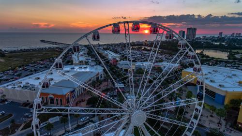PCB Wheel and Pier Park at sunset in Panama City Beach