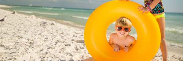 Kids on Beach with Tube