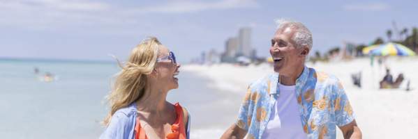 Winter Residents Walking Along The Beach