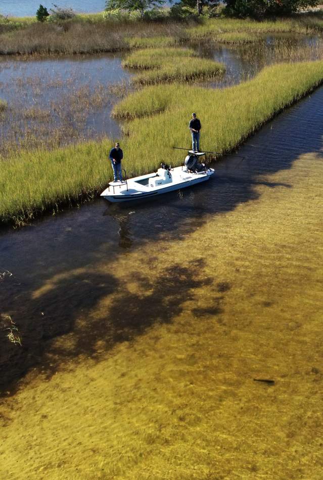 Two men fishing along the marsh in Panama City Beach
