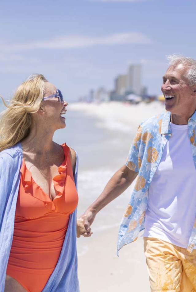 Winter Residents Walking Along The Beach