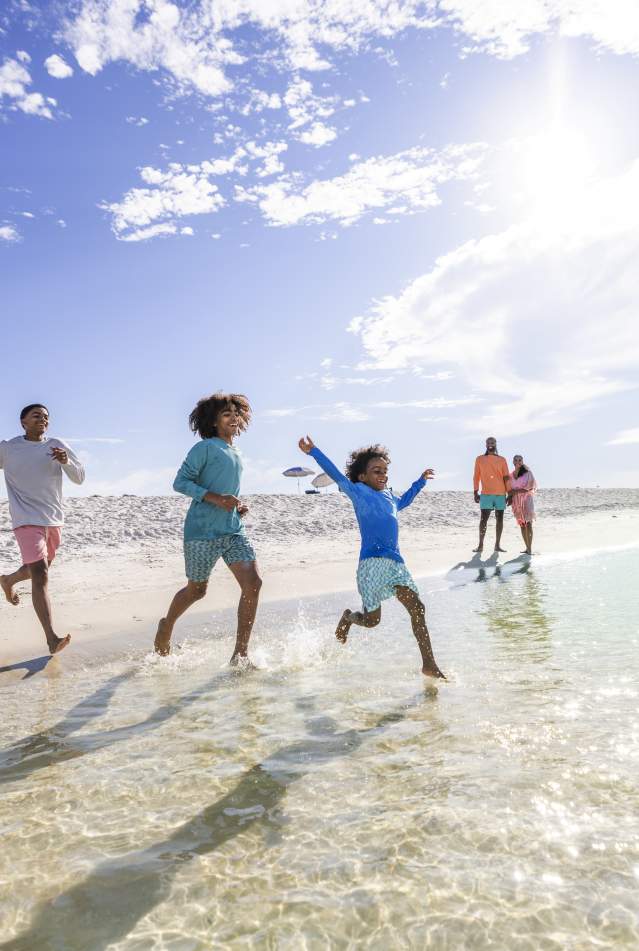 Kids running on beach