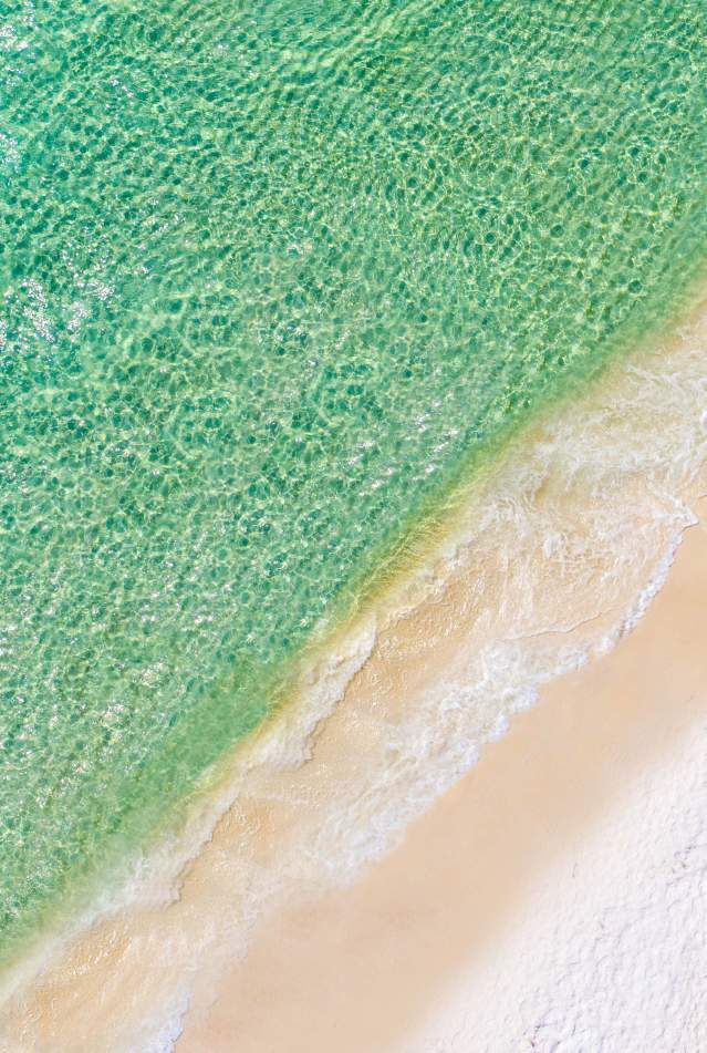 Aerial beach with umbrella chair