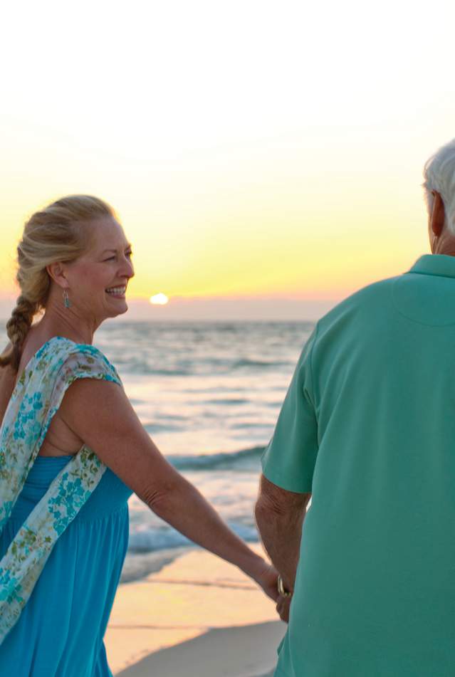 Florida Snowbirds enjoying sunset walk in Panama City Beach Florida