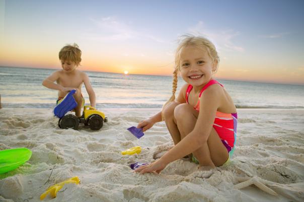 Kids Playing On The Beach