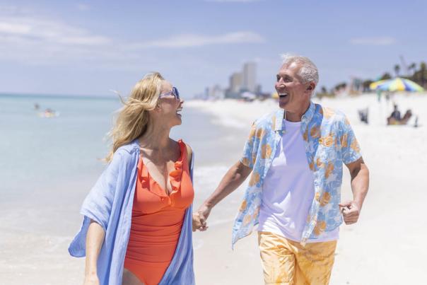 Winter Residents Walking Along The Beach