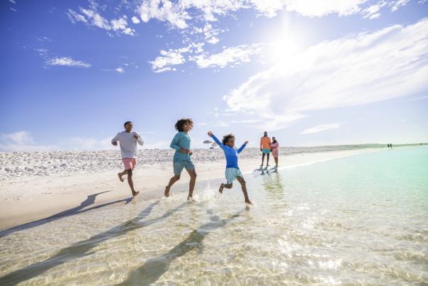 Kids running on beach