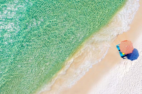 Aerial beach with umbrella chair