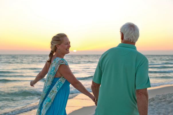 Florida Snowbirds enjoying sunset walk in Panama City Beach Florida