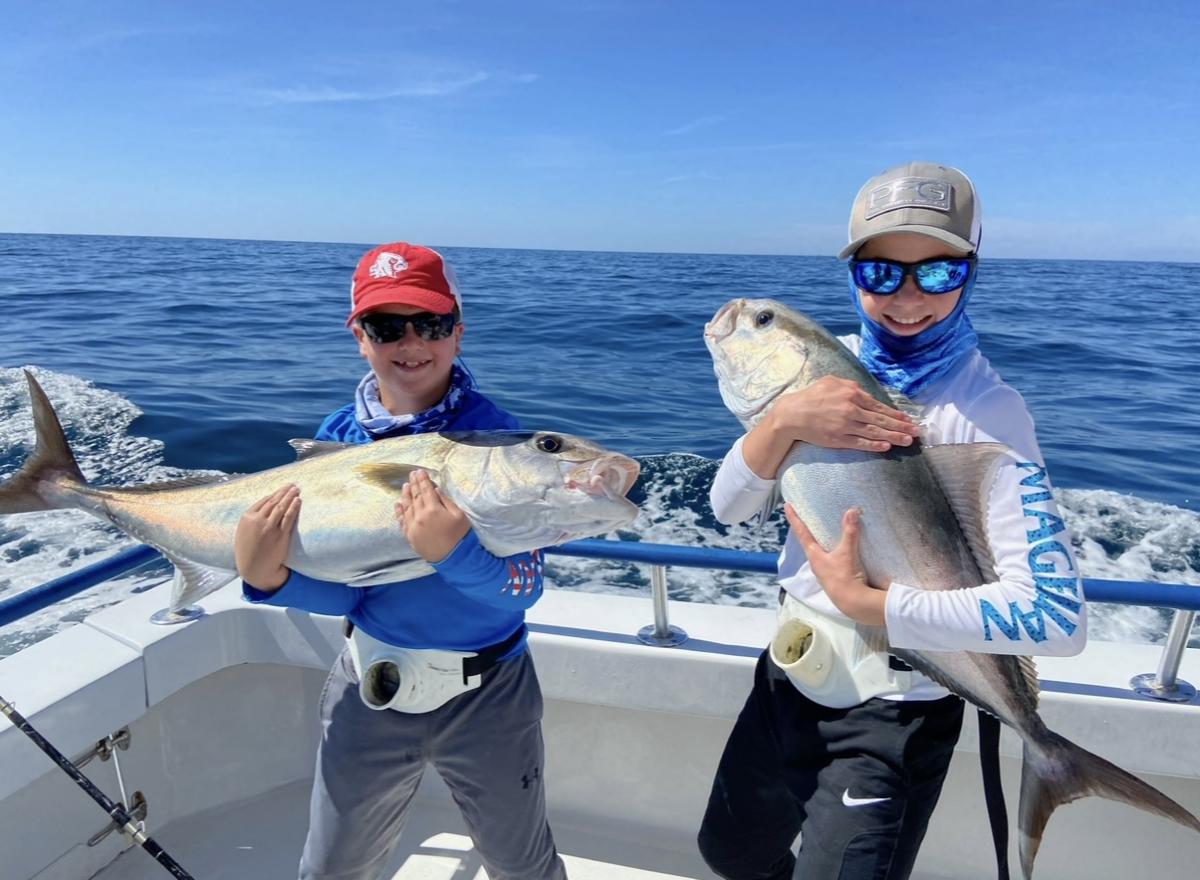 Kids holding fish