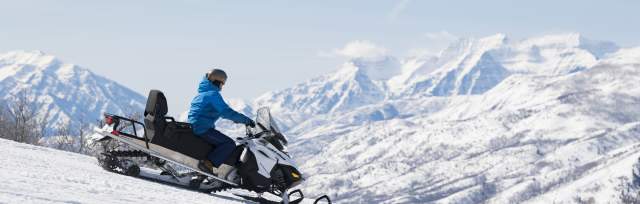 Snowmobile on Ridge with Timpanogos in the background