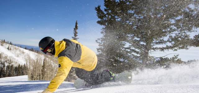 Snowboarder on groomer at Park City Mountain