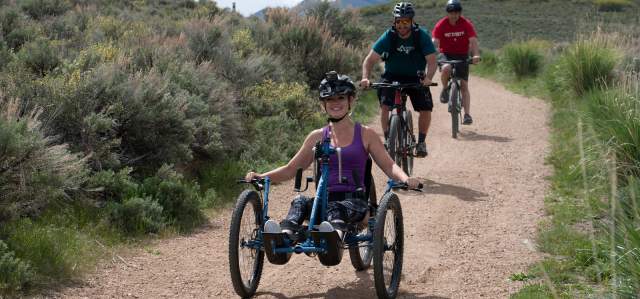 Women riding in a 4 cross mountain bike