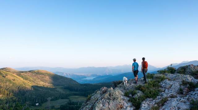 Couple enjoying a scenic view from top of mountain