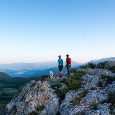 Couple enjoying a scenic view from top of mountain