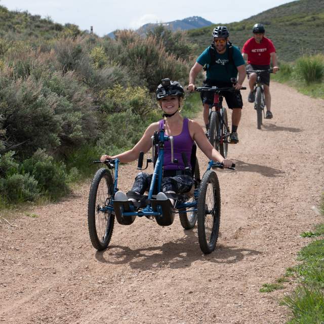 Women riding in a 4 cross mountain bike