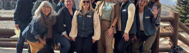 The Park City Chamber staff pose in a silly manner for a group photo at the Stein Eriksen Lodge in Park City, UT