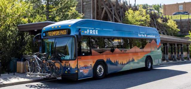 An electric bus loaded with bikes at the Old Town Transit Center in Park City, UT