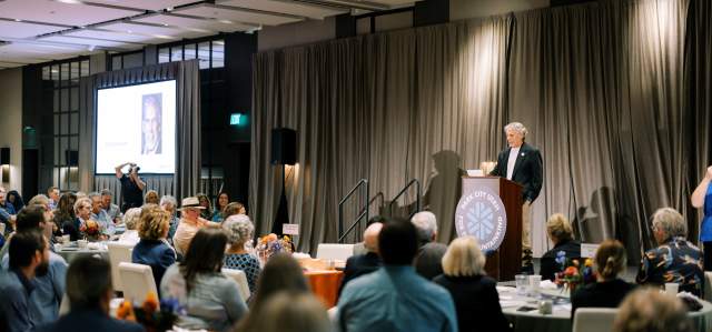 Myles Rademan giving speach at annual meeting