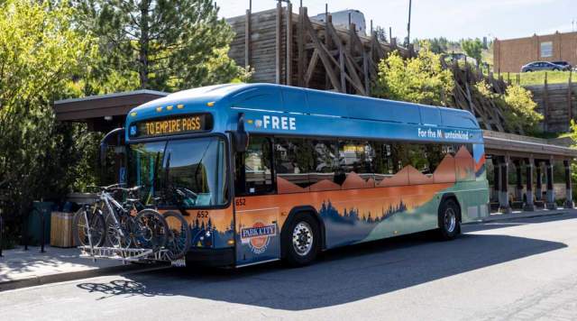 An electric bus loaded with bikes at the Old Town Transit Center in Park City, UT