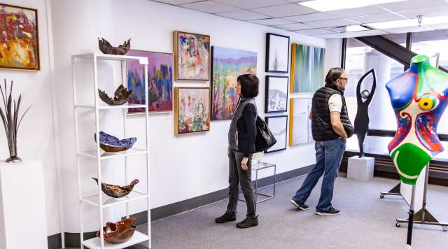 People observe art for sale at the Create PC gallery in Park City, UT