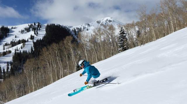 Woman Skiing Groomed Run