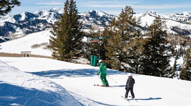 Deer Valley Ski instructer skiing with a kid