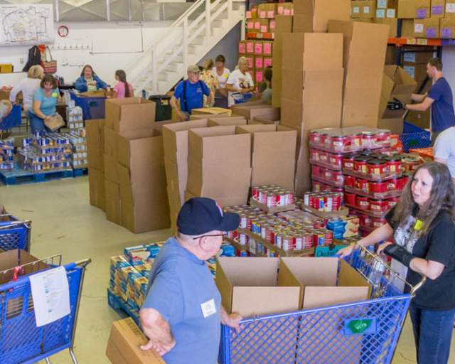 people in a packaging facility