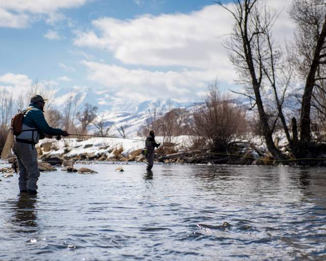 Two men casting fly fishing line in Provo River