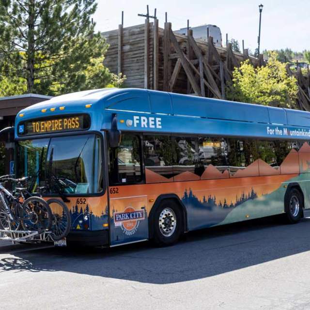An electric bus loaded with bikes at the Old Town Transit Center in Park City, UT