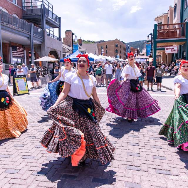 Women dancing for the Latino Arts Festival parade