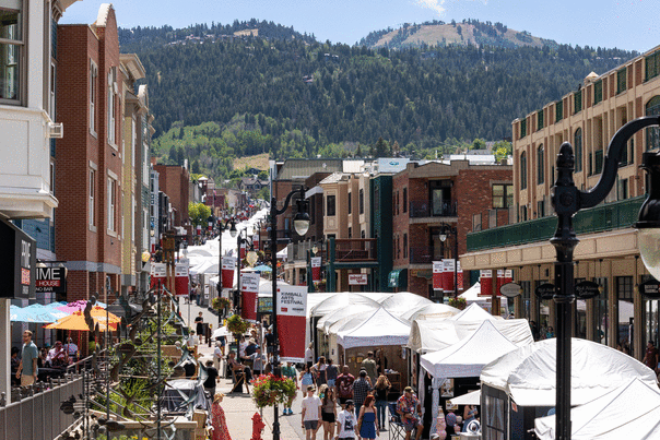 Kimball Arts Festival booths lining Main Street Park City on sunny day