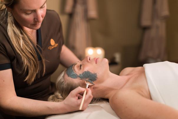Woman during a facial spa appointment