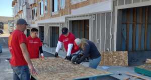 People working on house