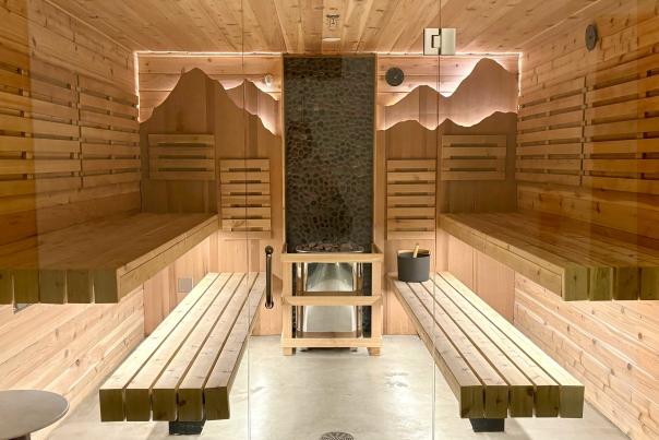 A sauna behind a glass door at the Avanto spa in Park City, UT