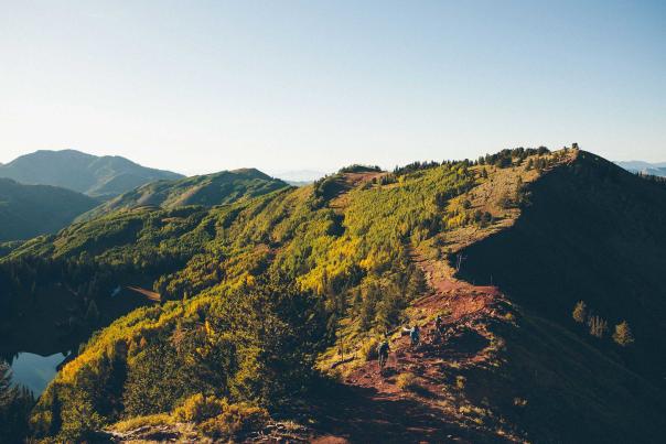 Two mountain bikers descend toward The Spine on the Wasatch Crest Trail near Park City, UT
