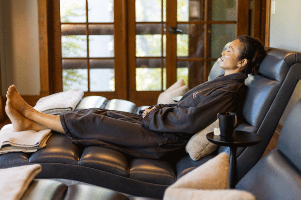 A woman relaxes on a chair in a spa in Park City, UT