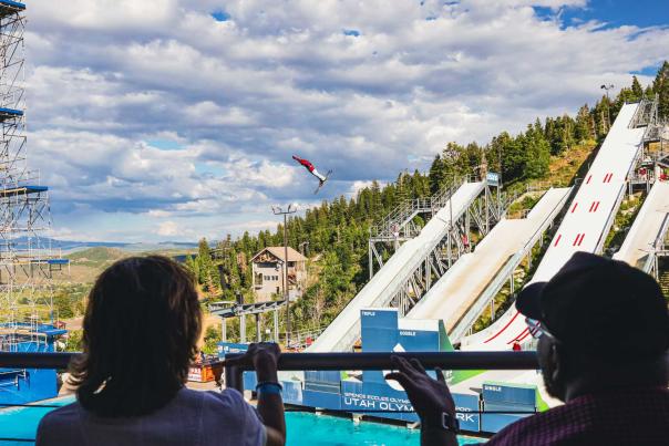 Two people enjoying the flying aces show at the Utah Olympic Park in Park City, UT